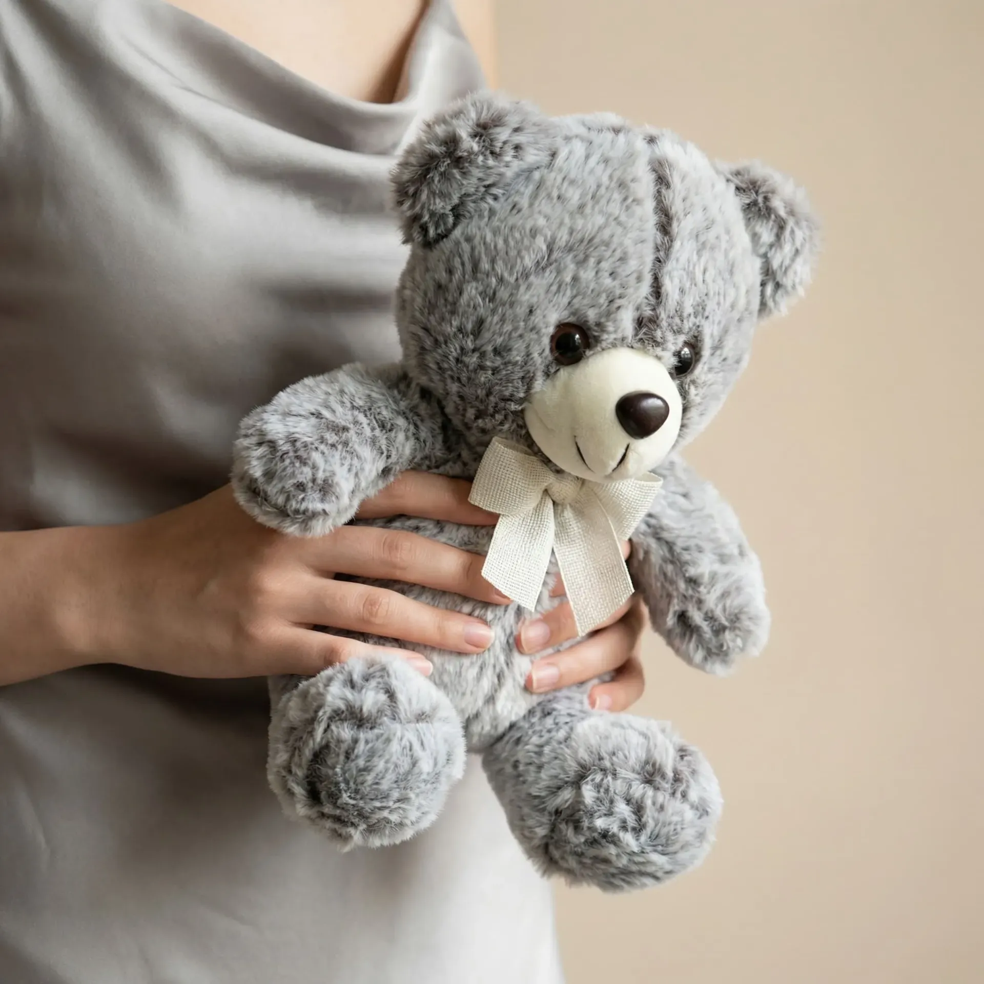 Plush toy "Teddy Bear" grey with a bow